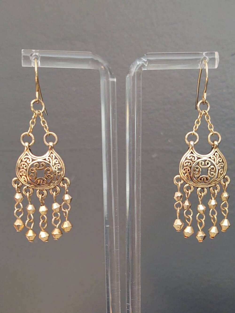 Gold scroll earrings with dangles